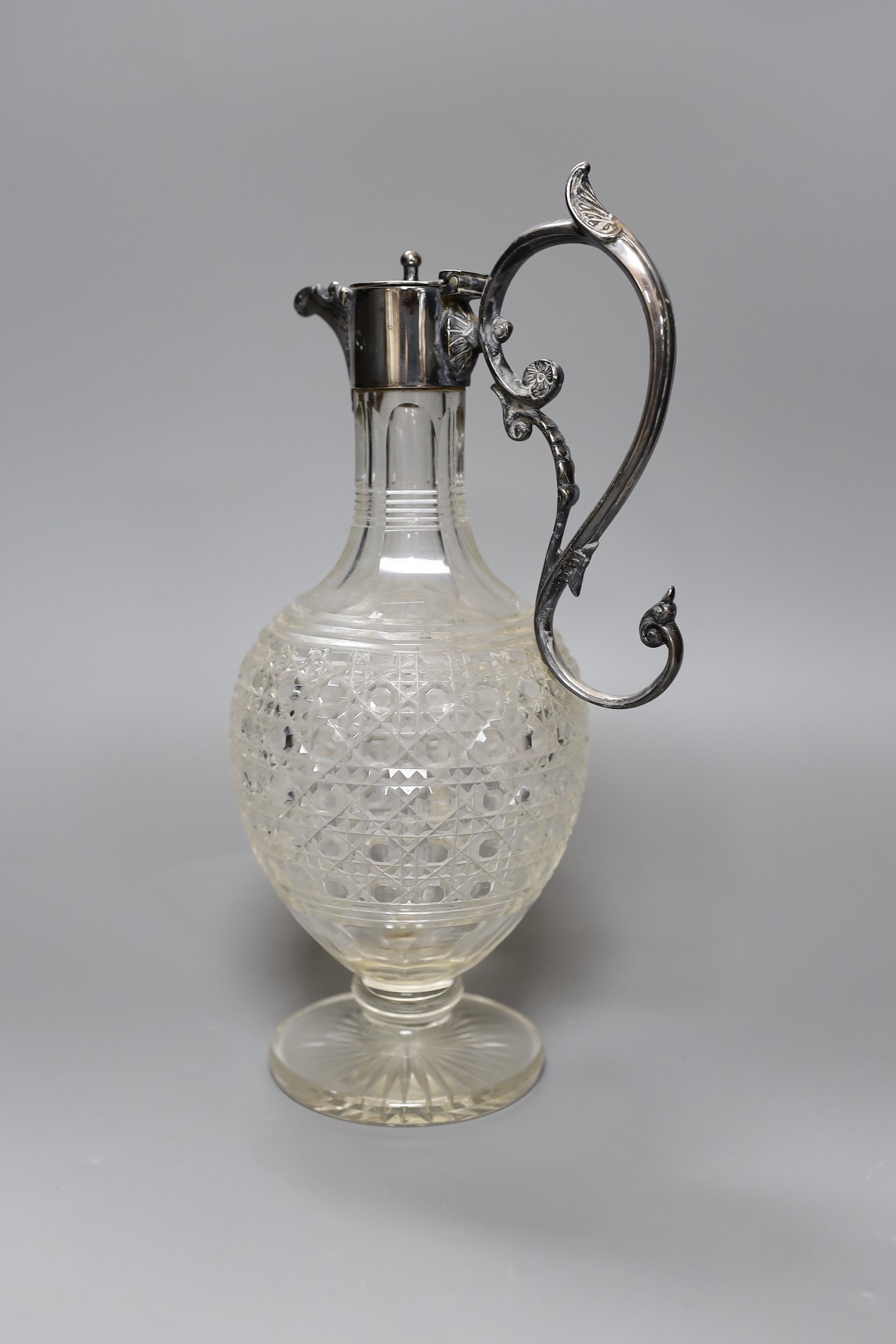 An electroplate mounted cut glass claret jug, 29 cms high